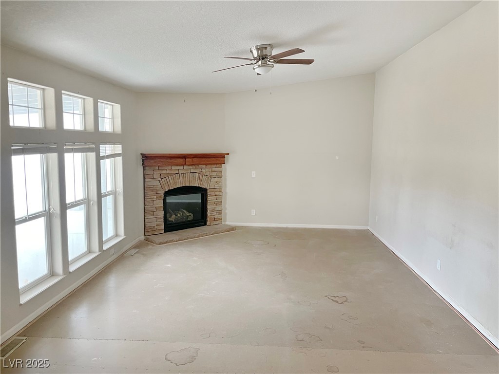 1740 West Wilson Road Pahrump, NV 89048 - Photo 4 of 13 Step down great room with propane fireplace