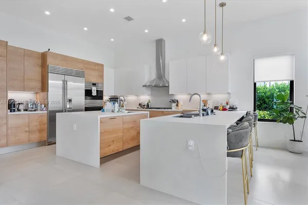 a living room with kitchen island furniture and a fireplace