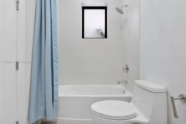 a room with furniture and a dresser