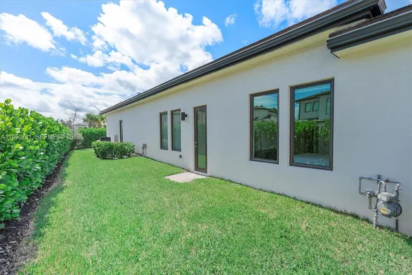 a view of a patio with a table and chairs