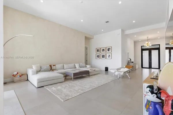 a living room with furniture and window