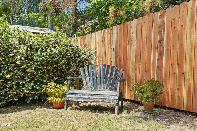 a view of a bench in backyard