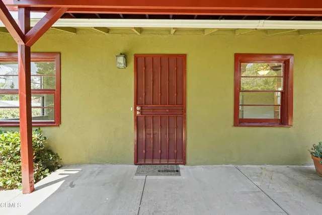 a view of a backyard with sitting area