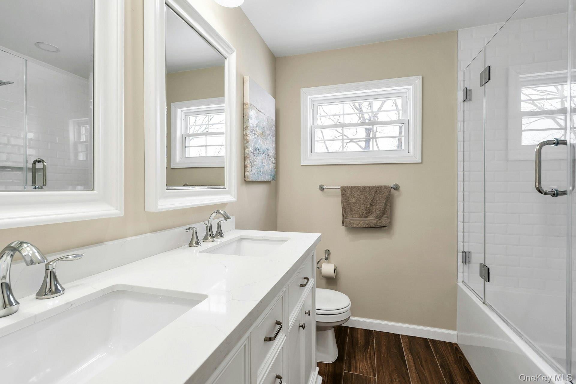 2043 Ripley Lane Merrick, NY 11566 - Photo 32 of 42 a bathroom with a sink toilet and shower