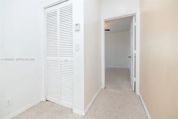 a spacious bathroom with a granite countertop sink and a mirror