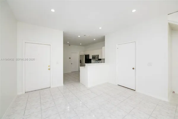 a view of an entryway with wooden floor