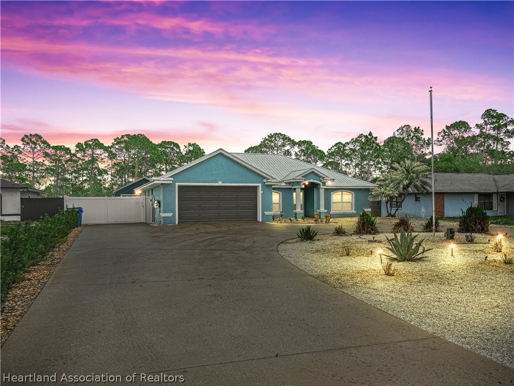 5430 Lakewood Road Sebring, FL 33875 - Photo 2 of 40 a view of a house with a patio
