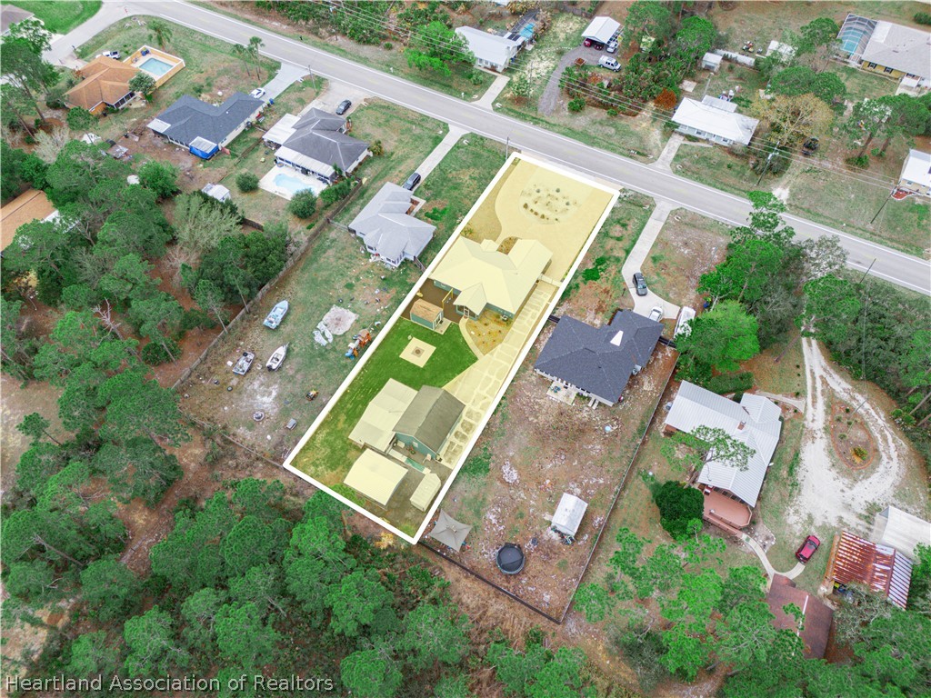 5430 Lakewood Road Sebring, FL 33875 - Photo 38 of 40 an aerial view of a house a yard and street