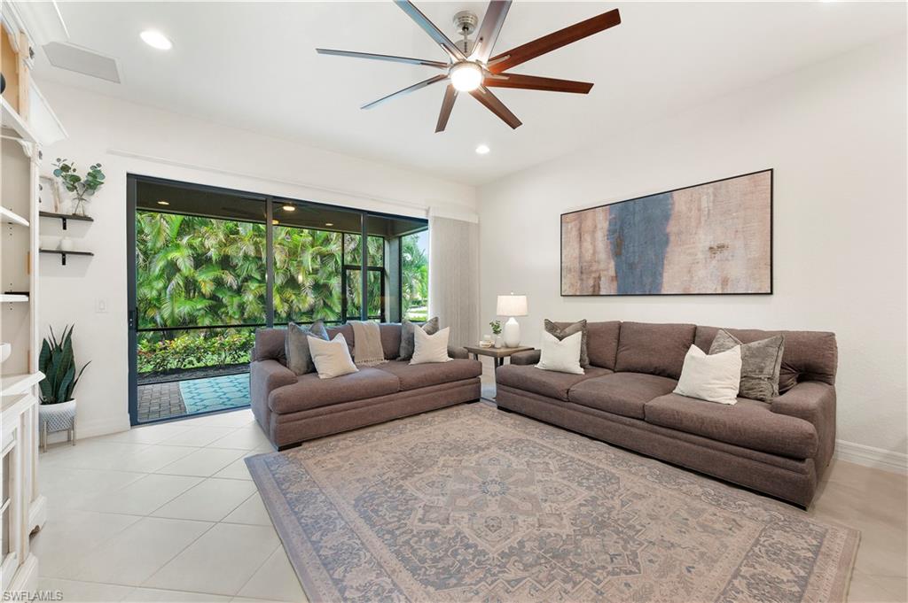 11989 Five Waters Circle Fort Myers, FL 33913 - Photo 14 of 32 a living room with furniture and a large window