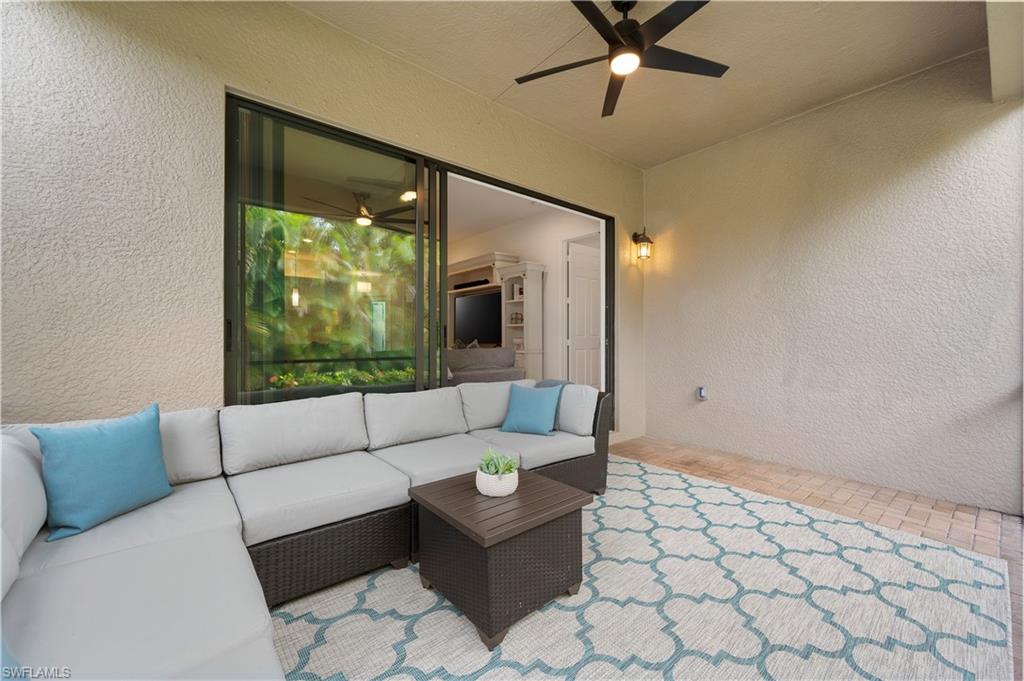 11989 Five Waters Circle Fort Myers, FL 33913 - Photo 22 of 32 a living room with furniture and a large window
