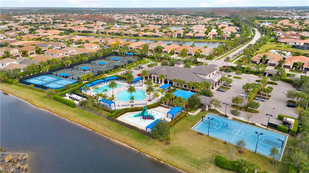 11989 Five Waters Circle Fort Myers, FL 33913 - Photo 28 of 32 an aerial view of residential houses with outdoor space and swimming pool