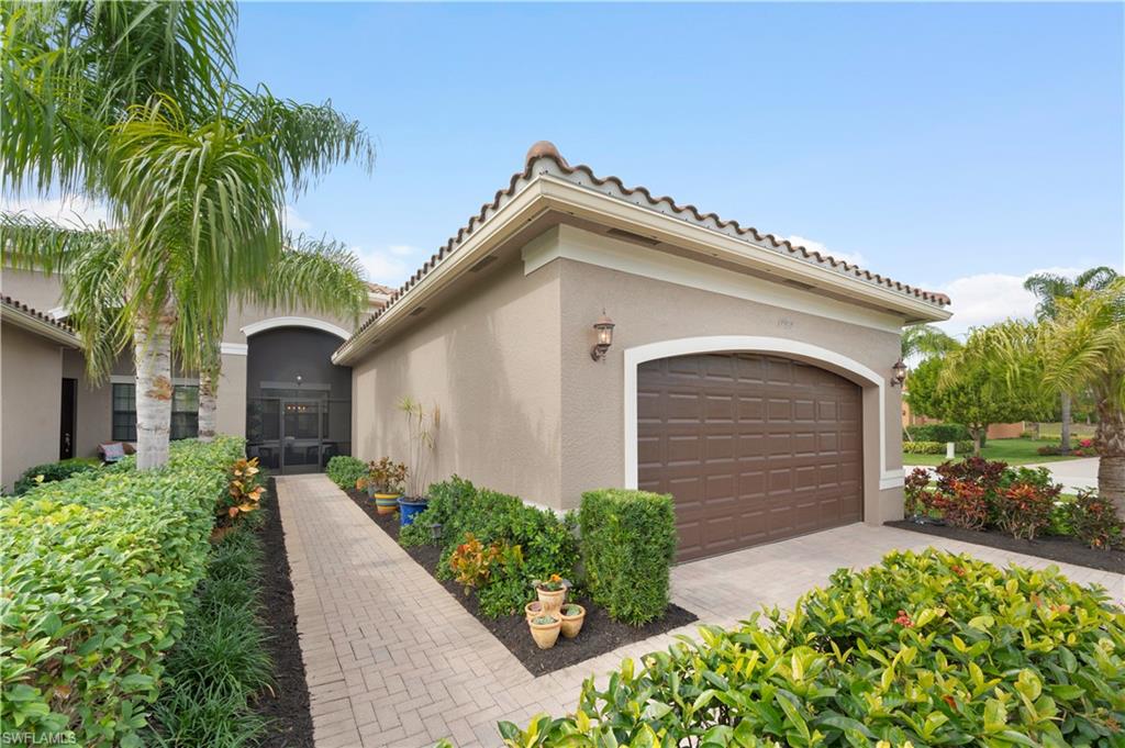 11989 Five Waters Circle Fort Myers, FL 33913 - Photo 3 of 32 a front view of house with yard and green space