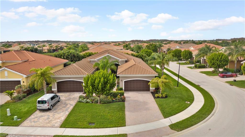 11989 Five Waters Circle Fort Myers, FL 33913 - Photo 31 of 32 a view of a garden with a house