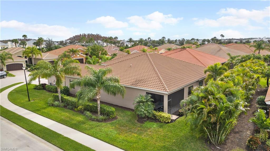 11989 Five Waters Circle Fort Myers, FL 33913 - Photo 32 of 32 a aerial view of a house with a yard and potted plants
