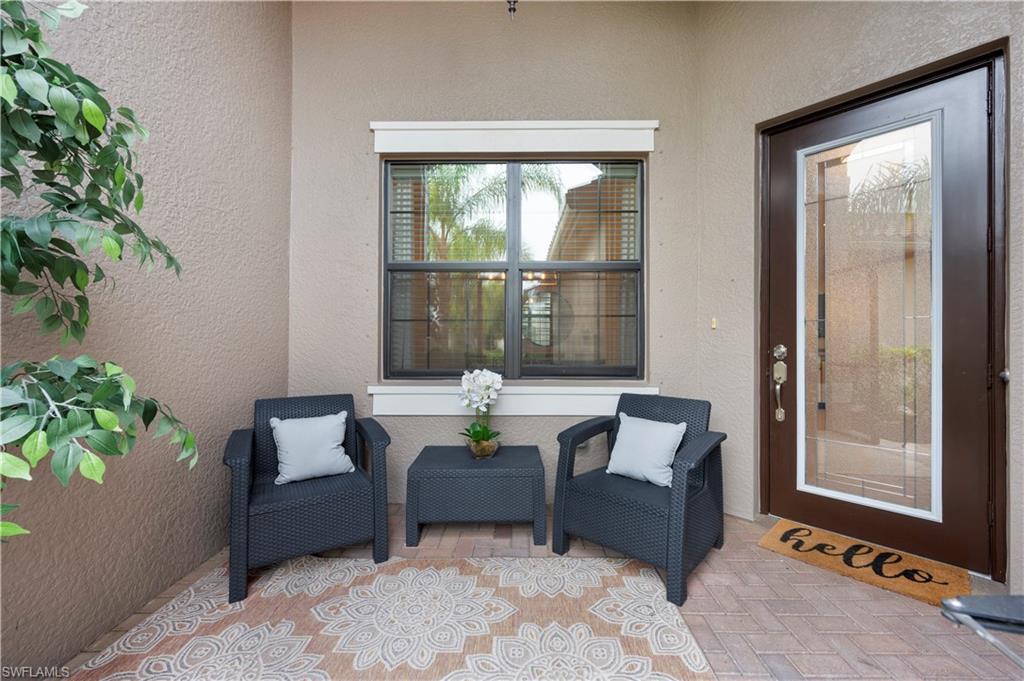 11989 Five Waters Circle Fort Myers, FL 33913 - Photo 5 of 32 a living room with furniture and a potted plant