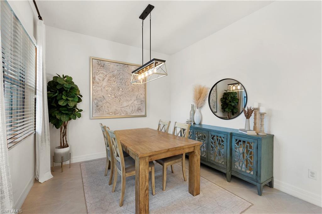 11989 Five Waters Circle Fort Myers, FL 33913 - Photo 9 of 32 a table and chairs in a room