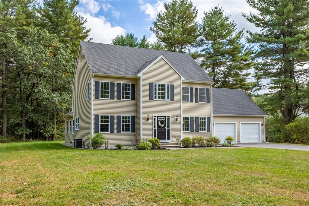 3 Gilson Road Littleton, MA 01460 - Photo 1 of 36 a front view of a house with a garden