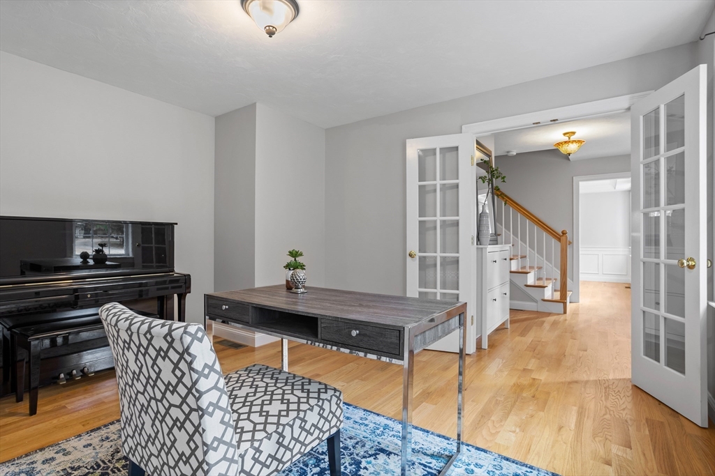 3 Gilson Road Littleton, MA 01460 - Photo 14 of 36 a living room with furniture and a flat screen tv