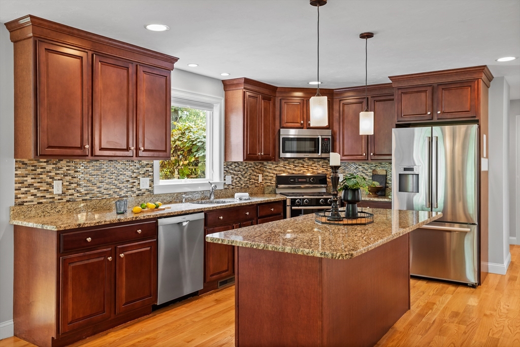 3 Gilson Road Littleton, MA 01460 - Photo 16 of 36 a kitchen with stainless steel appliances granite countertop a refrigerator a sink dishwasher a stove and a refrigerator