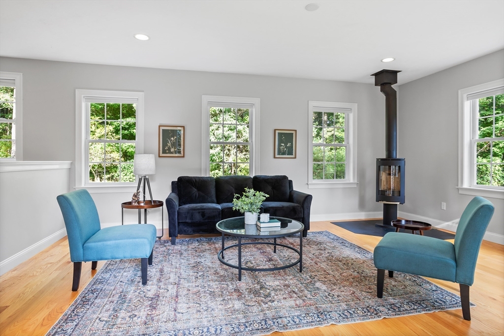 3 Gilson Road Littleton, MA 01460 - Photo 21 of 36 a living room with furniture a window and a potted plant