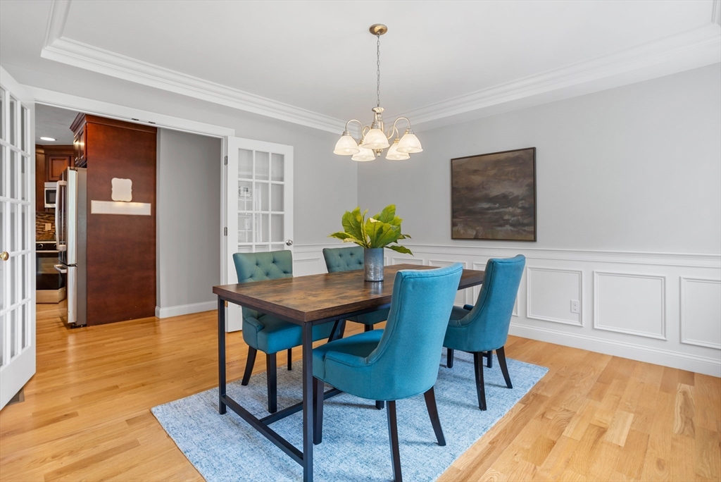 3 Gilson Road Littleton, MA 01460 - Photo 23 of 36 a view of a dining room with furniture and wooden floor
