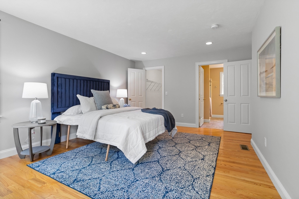 3 Gilson Road Littleton, MA 01460 - Photo 27 of 36 a bedroom with a bed and wooden floor