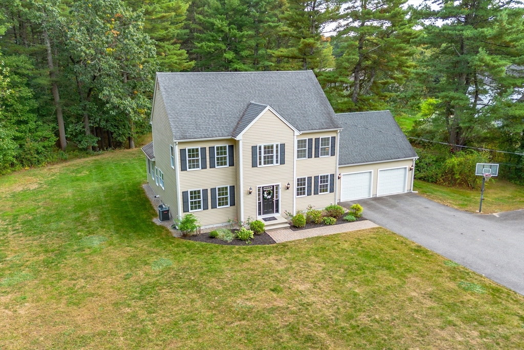 3 Gilson Road Littleton, MA 01460 - Photo 3 of 36 a house that has a lot of plants in it