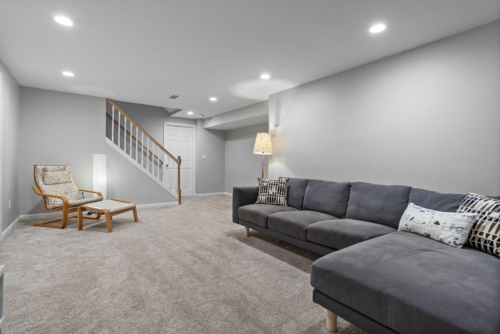 3 Gilson Road Littleton, MA 01460 - Photo 31 of 36 a living room with furniture and a ceiling fan