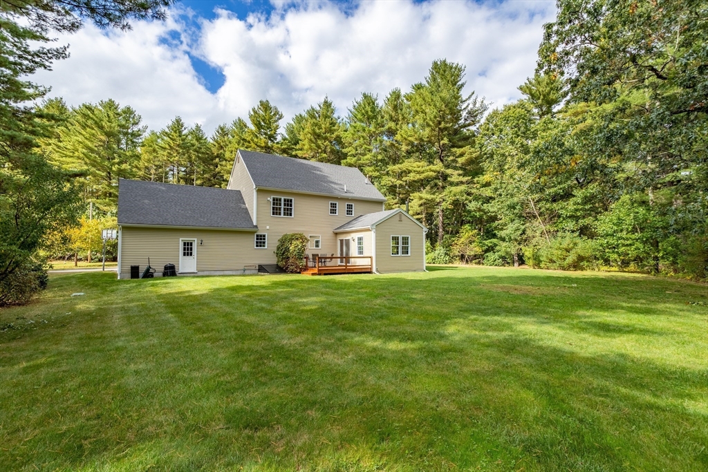 3 Gilson Road Littleton, MA 01460 - Photo 4 of 36 a front view of a house with a yard
