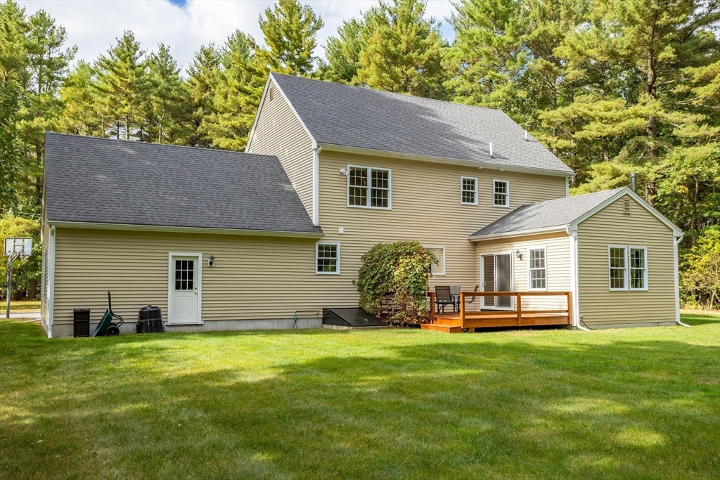 3 Gilson Road Littleton, MA 01460 - Photo 5 of 36 a front view of house with yard and outdoor seating