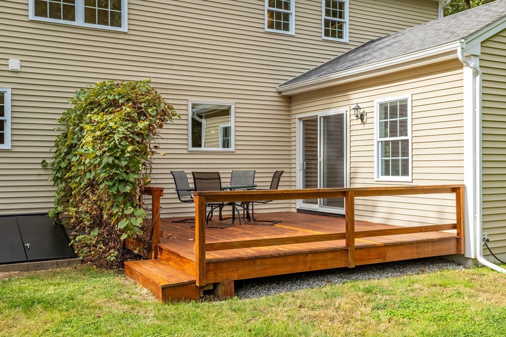 3 Gilson Road Littleton, MA 01460 - Photo 6 of 36 a view of a house with a backyard