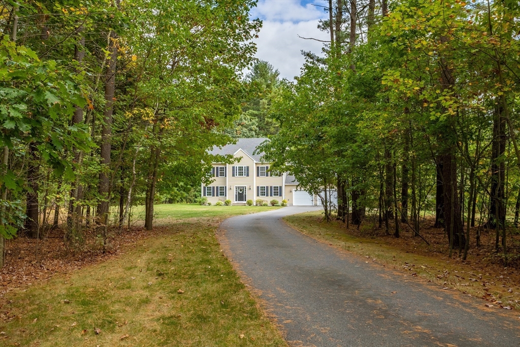 3 Gilson Road Littleton, MA 01460 - Photo 8 of 36 a view of a house with backyard and trees