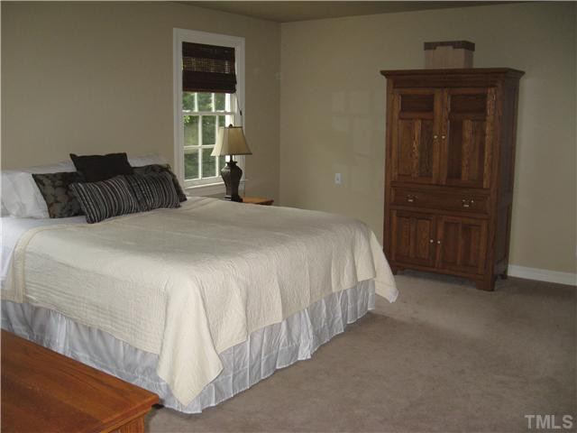 14405 Possum Track Road Raleigh, NC 27614 - Photo 10 of 25 the comfortable master bedroom is at the rear of the house and enjoys an elevated view onto the lake Master Bedroom