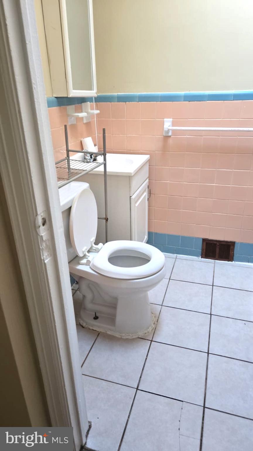 5202 F Street Philadelphia, PA 19124 - Photo 11 of 14 a bathroom with a sink and a toilet