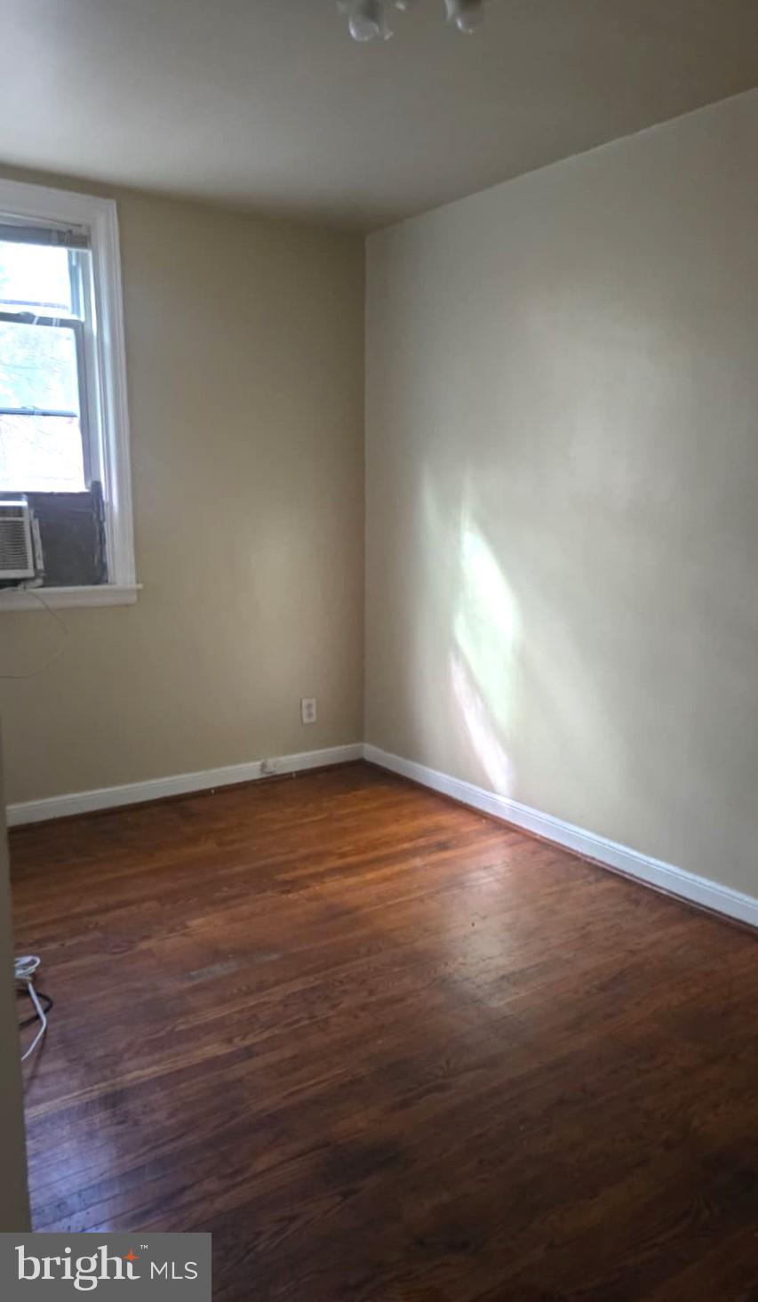 5202 F Street Philadelphia, PA 19124 - Photo 13 of 14 an empty room with wooden floor and windows