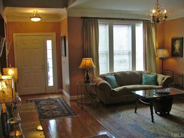 3910 Stags Leap Circle Raleigh, NC 27612 - Photo 11 of 12 a living room with furniture and a window