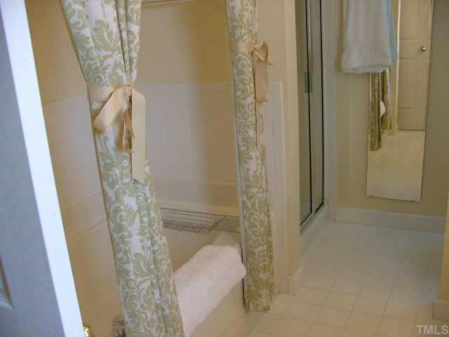 3910 Stags Leap Circle Raleigh, NC 27612 - Photo 3 of 12 a bathroom with a shower