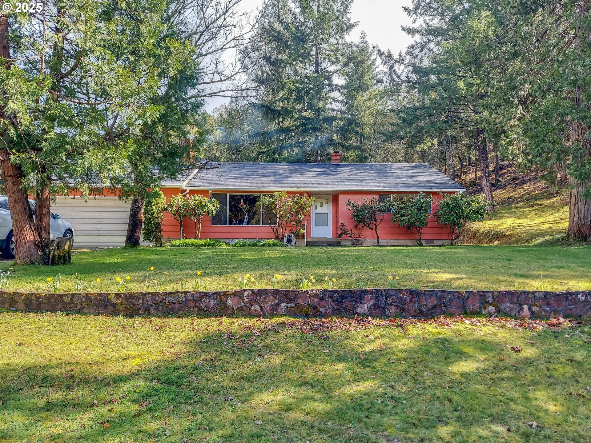 1260 Canyonville-Riddle Road Riddle, OR 97469 - Photo 1 of 44 a front view of a house with a yard