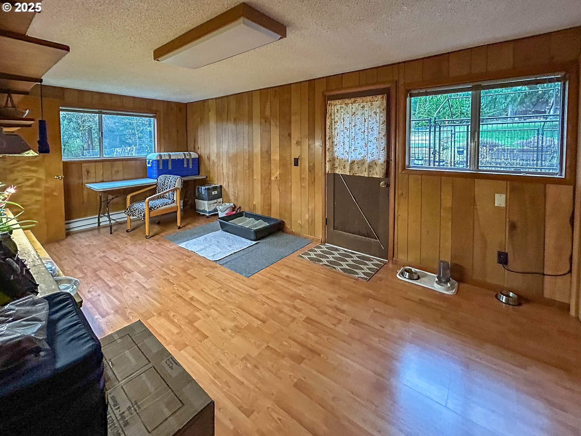 1260 Canyonville-Riddle Road Riddle, OR 97469 - Photo 12 of 44 a living room with furniture window and wooden floor