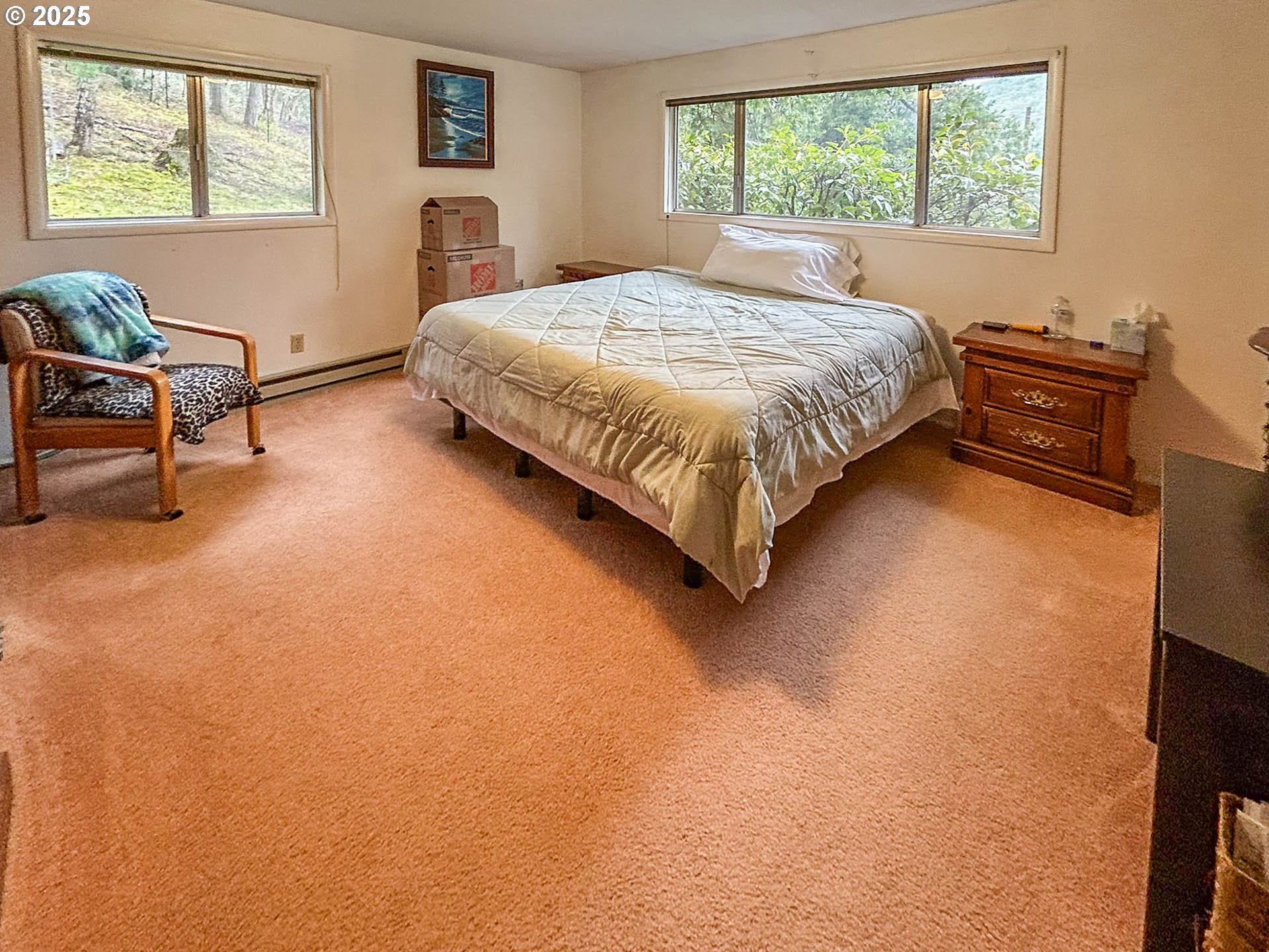 1260 Canyonville-Riddle Road Riddle, OR 97469 - Photo 18 of 44 a bedroom with a bed chair and a window