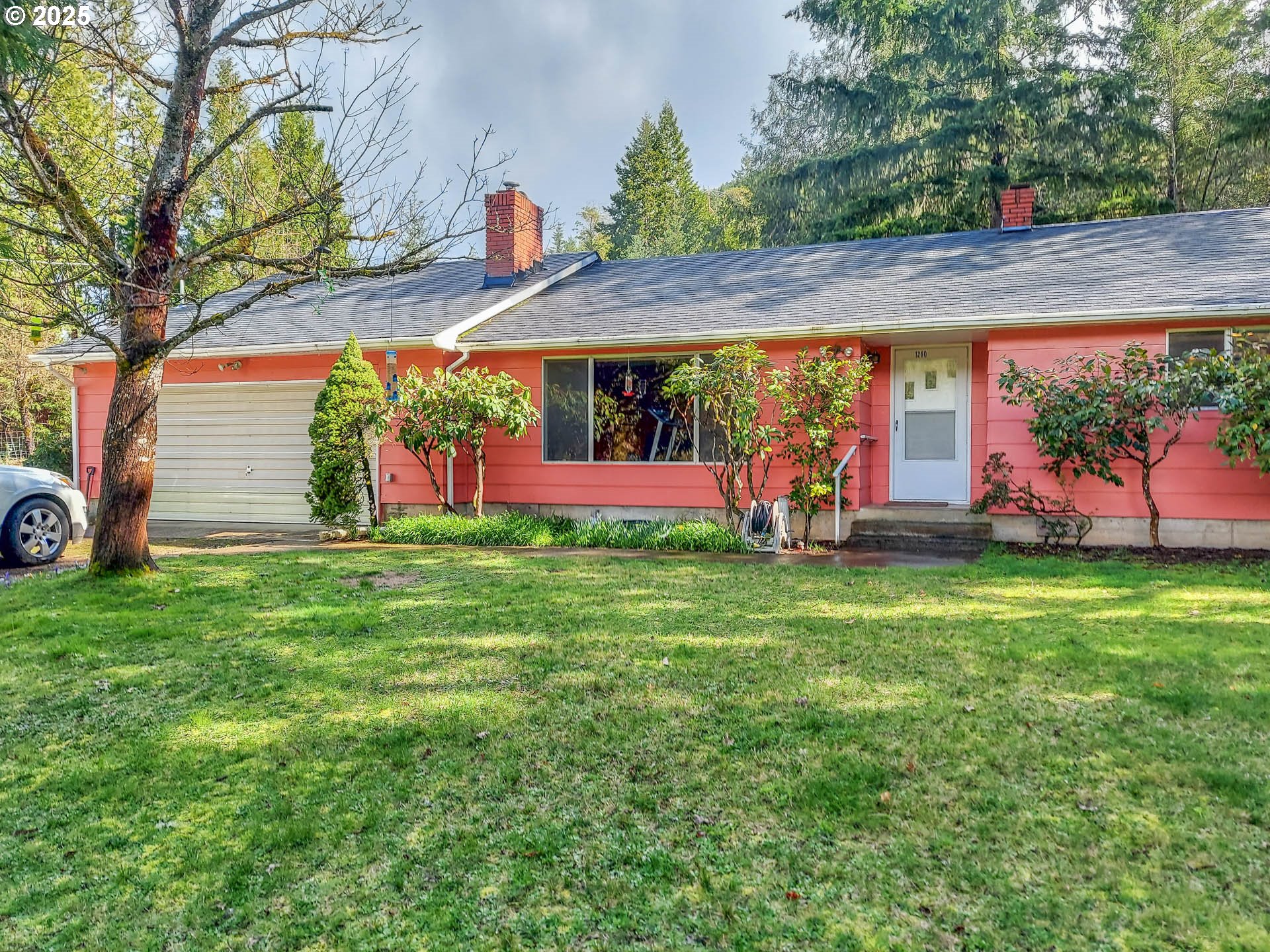 1260 Canyonville-Riddle Road Riddle, OR 97469 - Photo 2 of 44 a view of a house with a yard