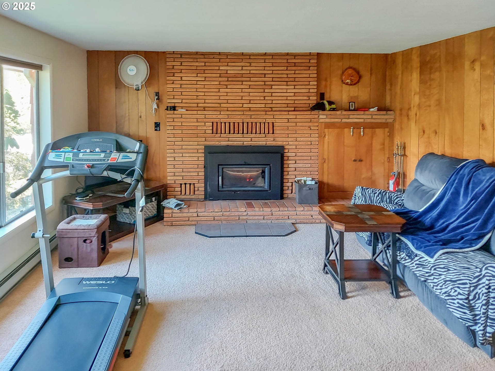 1260 Canyonville-Riddle Road Riddle, OR 97469 - Photo 4 of 44 a living room with furniture and a fireplace