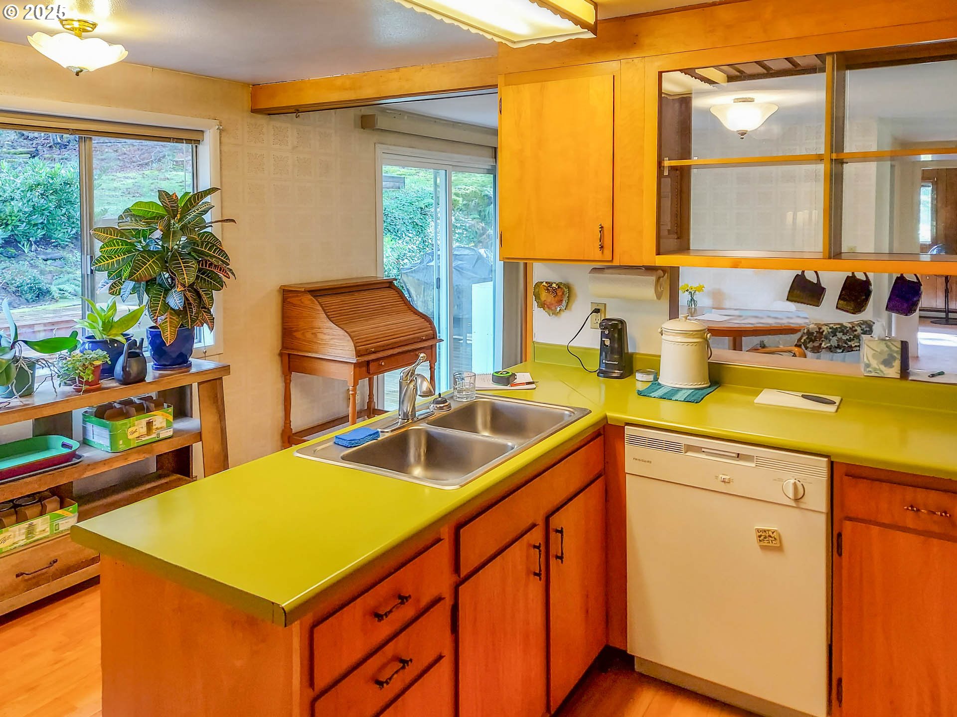 1260 Canyonville-Riddle Road Riddle, OR 97469 - Photo 8 of 44 a kitchen that has a sink and a stove with it