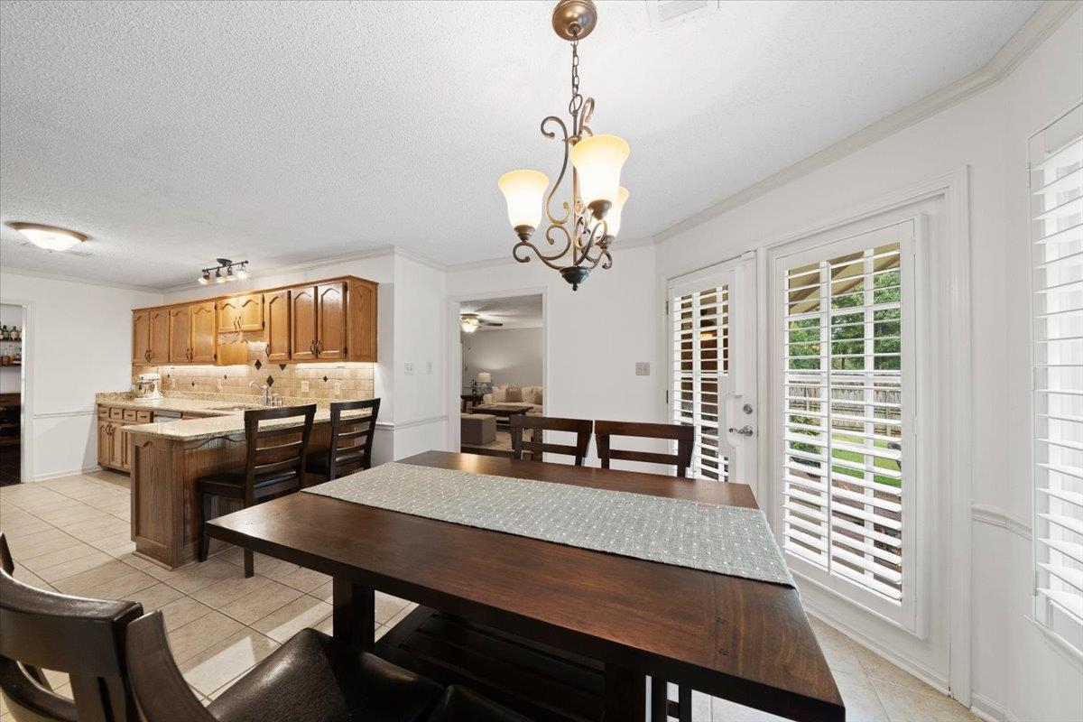 276 Morton Road Collierville, TN 38017 - Photo 11 of 33 a view of a dining room with furniture window and wooden floor