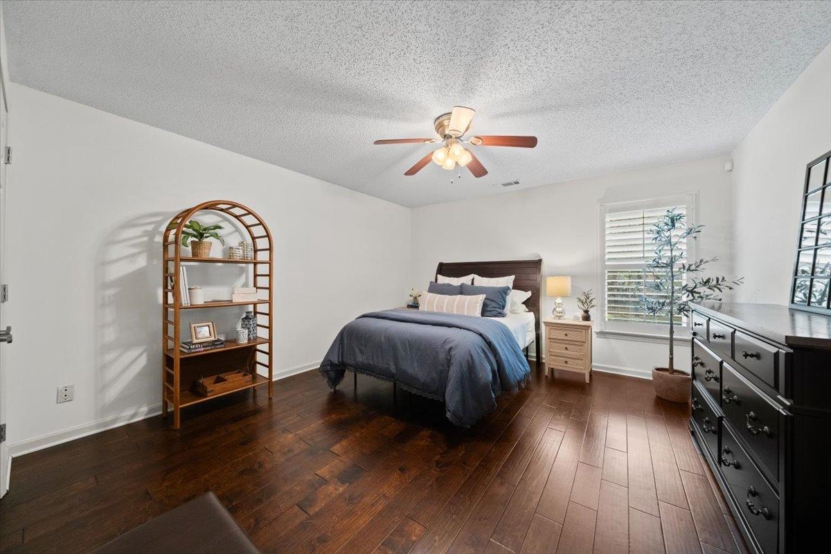 276 Morton Road Collierville, TN 38017 - Photo 19 of 33 a bedroom with a bed and wooden floor