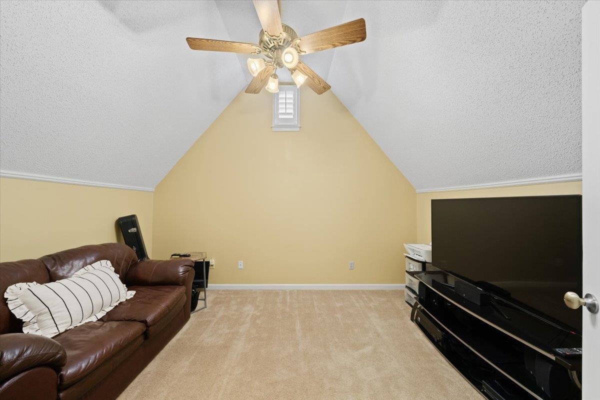 276 Morton Road Collierville, TN 38017 - Photo 21 of 33 a living room with furniture and a flat screen tv