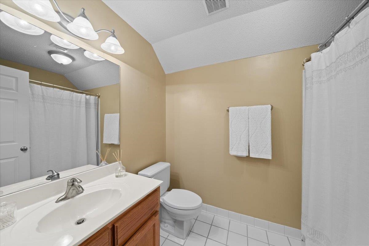 276 Morton Road Collierville, TN 38017 - Photo 22 of 33 a bathroom with a toilet sink and mirror