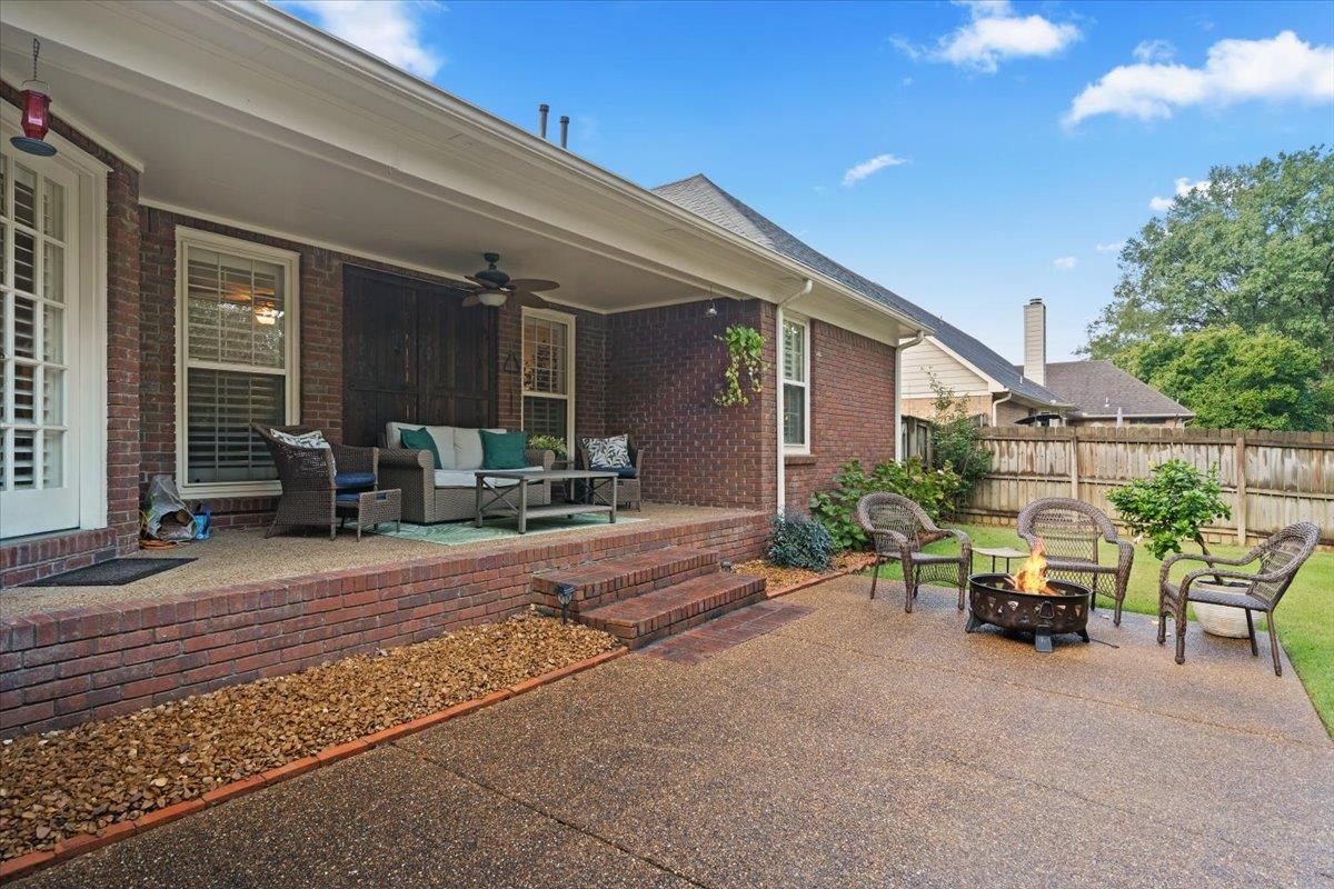 276 Morton Road Collierville, TN 38017 - Photo 24 of 33 a view of a patio with table and chairs and potted plants