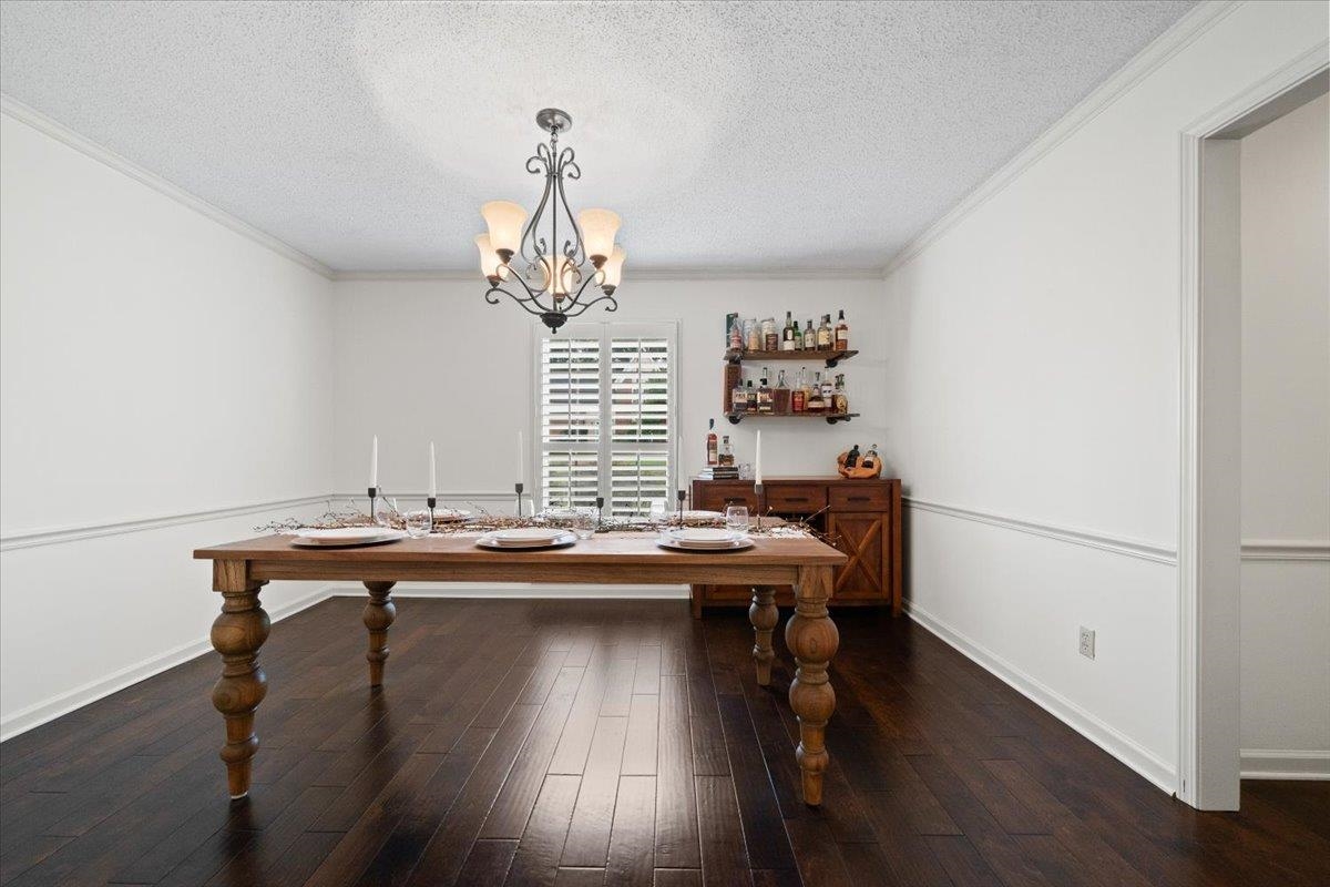 276 Morton Road Collierville, TN 38017 - Photo 33 of 33 a room with a table chairs and wooden floor
