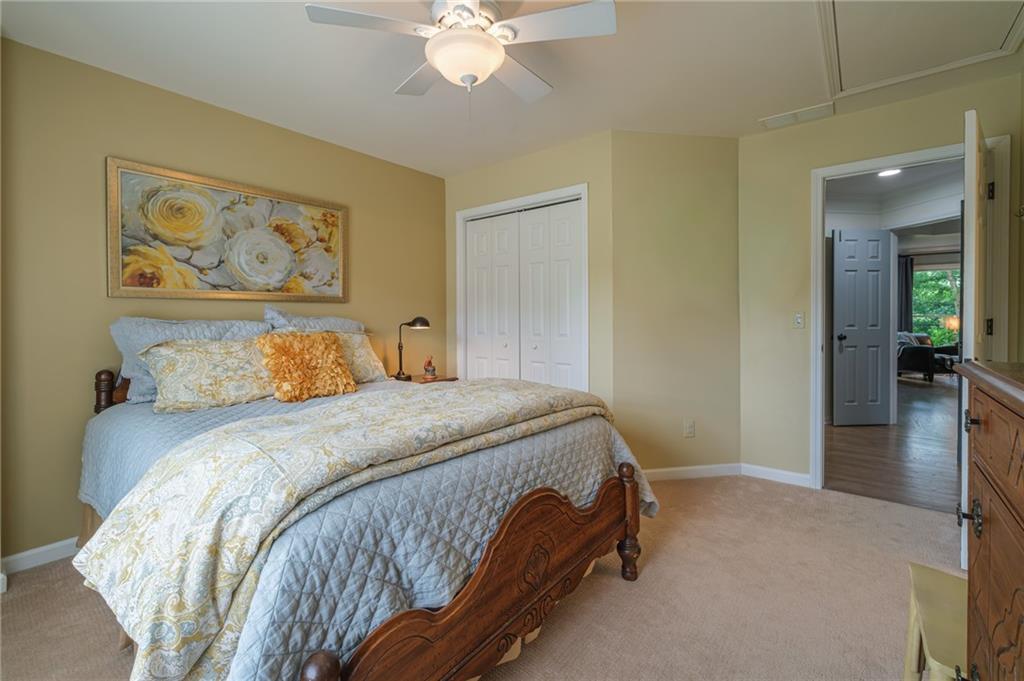 4330 Farmbrook Lane Cumming, GA 30041 - Photo 29 of 46 a bedroom with a bed and lamp
